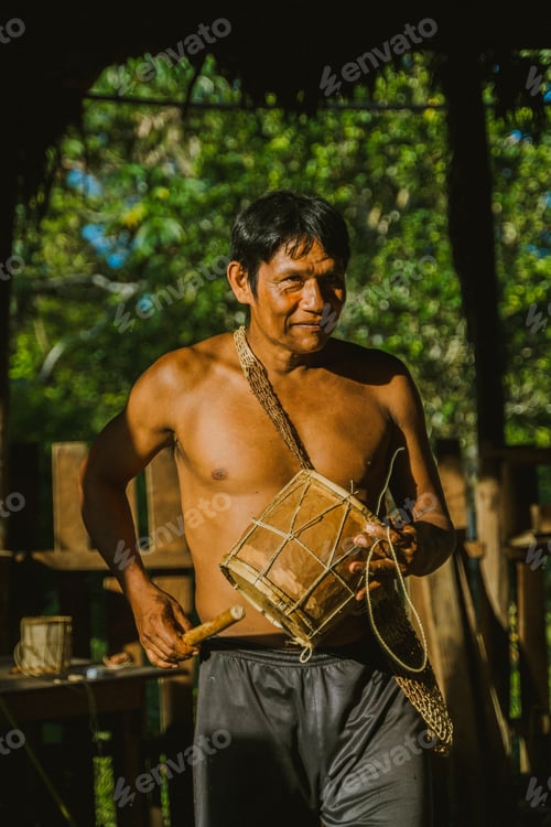 Preview: Local man playing drum in sunlight