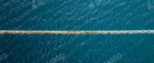 Preview: Stretched tight rope on a blue sea background