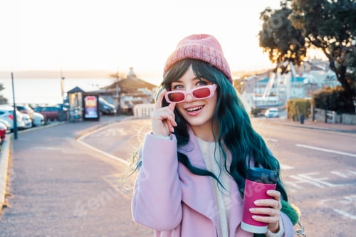 Preview: Portrait of Stylish young smiling hipster woman with color hair holding reusable coffee cup