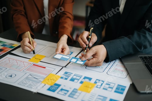 Preview: UX developer and ui designer brainstorming about mobile app interface wireframe design with customer