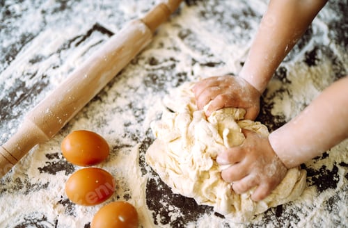 Preview: Children hands kneading dough for baking. Kids hands, some flour, wheat dough. Cookies for Christmas
