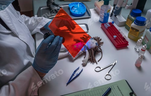 Preview: Police scientist investigates rag doll with ultraviolet light,