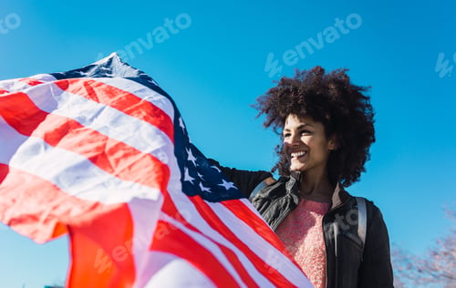 Preview: black woman with afro hair and an american flag