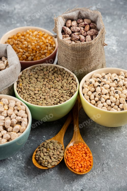 Preview: Different type of raw dry legumes composition on marble surface
