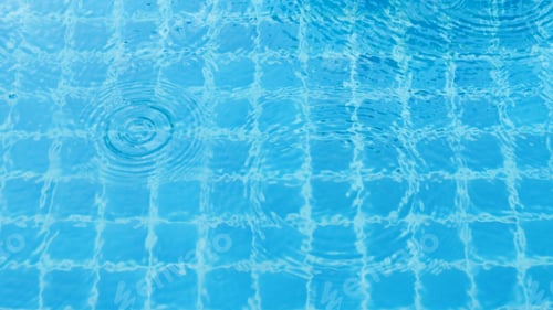 Preview: Rain drops on the swimming pool.