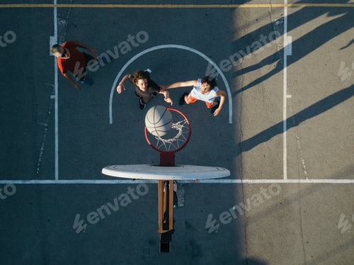 Preview: Overhead view of friends on basketball court playing basketball game
