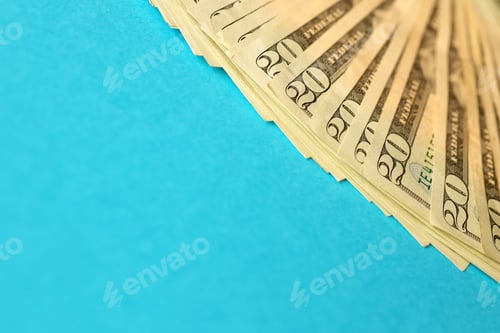 Preview: Big amount of old twenty dollar bills on blue background. Money earnings