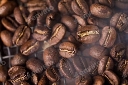 Preview: Coffee beans texture or coffee background. Fragrant fried bean a-smoke.