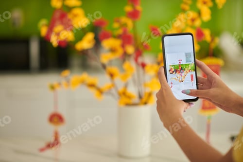 Preview: Woman Photographing Blooming Branches