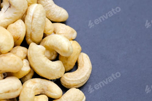 Preview: Cashew nuts on dark background.