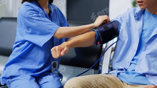 Preview: Asian nurse checking patient hypertension