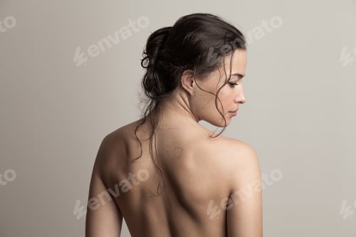 Preview: natural beauty concept young woman with wet hair in bun profile and back studio shot
