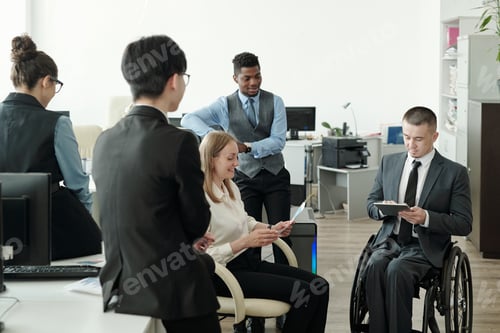 Preview: Intercultural subordinates interacting with boss in wheelchair