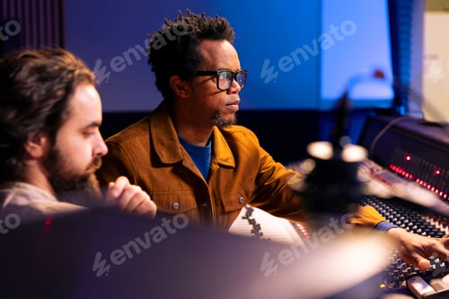 Preview: Diverse team of artist and expert working on editing tracks for a new album