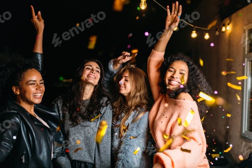 Preview: Group of girls dancing at night outdoors. Friends having good times together.
