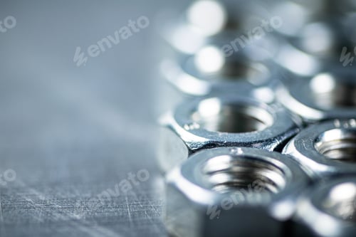 Preview: Working tool. Metal nuts on the table.