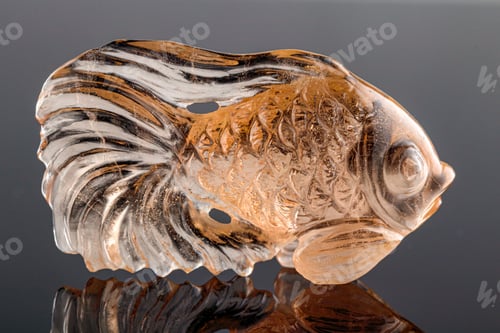 Preview: beautiful figurine fish made of topaz on a gray background