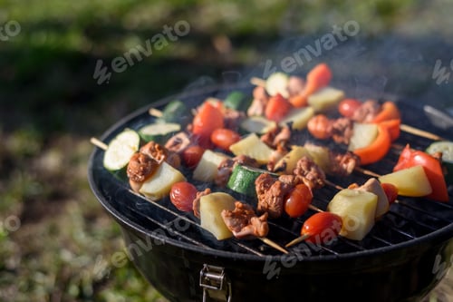 Preview: Pieces meat and vegetables bbq on grill