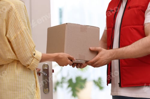 Preview: Woman receiving parcel from deliveryman on blurred background, closeup. Space for text