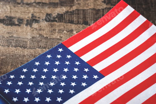 Preview: American flag folded on rustic wooden surface celebrating usa patriotism