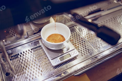 Preview: Professional coffee machine brewing espresso in cafe