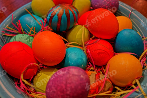 Preview: High angle closeup shot of a bowl of colorful Easter eggs