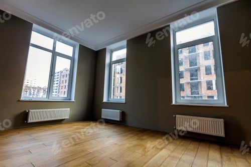 Preview: New renovated room interior with big windows, heating radiators