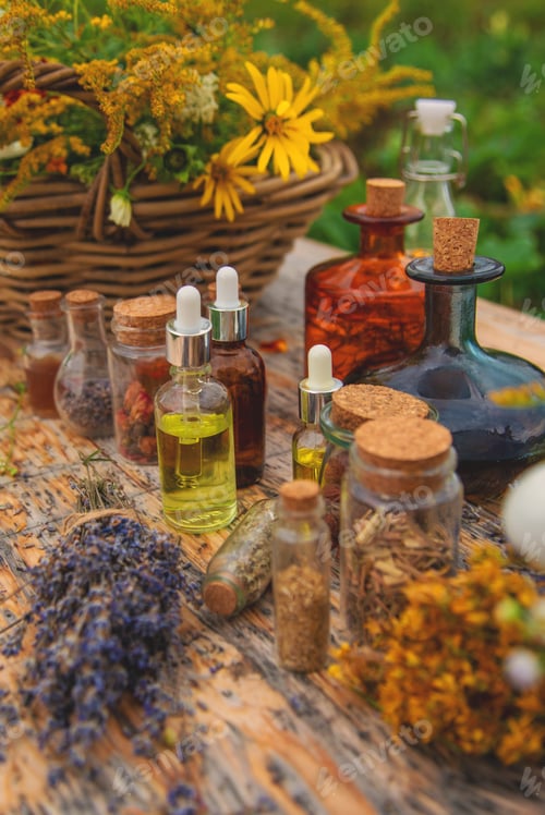 Preview: Medicinal herbs and tinctures on the table. Selective focus.