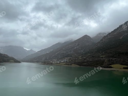 Preview: Amazing landscape in a rainy day, lake, mountains, cloudy sky, raindrops, natural background
