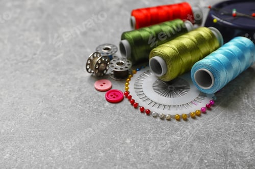 Preview: Composition with threads and sewing accessories on grey background