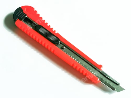 Preview: Side view of red utility knife isolated on white background.