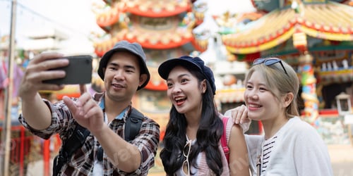 Preview: Friendship travel moments capturing joyful experiences at a cultural landmark group perspective