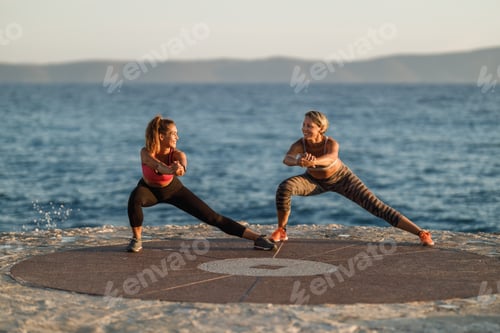 Preview: Two Women Doing Outdoors Workout Near The Sea