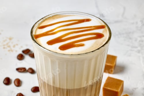 Preview: closeup of caramel latte coffee glass