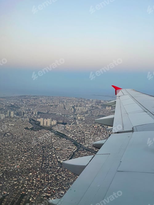 Preview: Flying over Istanbul. View from the airplane window to the sea and the city.