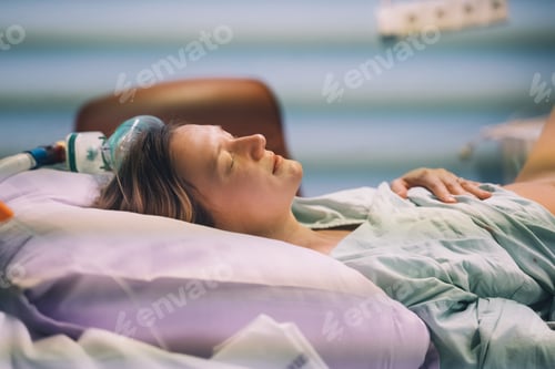 Preview: Childbirth. Woman giving birth in maternity hospital. Pregnant woman breathing during contractions.