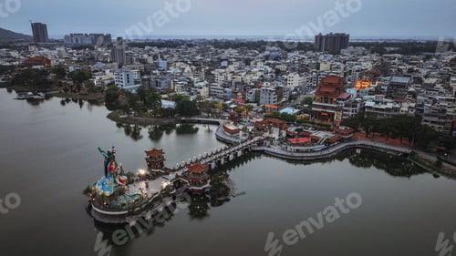 Preview: Aerial view of Kaohsiung, Taiwan, revealing its waterfront and cityscape at dusk