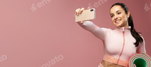 Preview: Website header of Cheerful young woman with yoga mat making selfie
