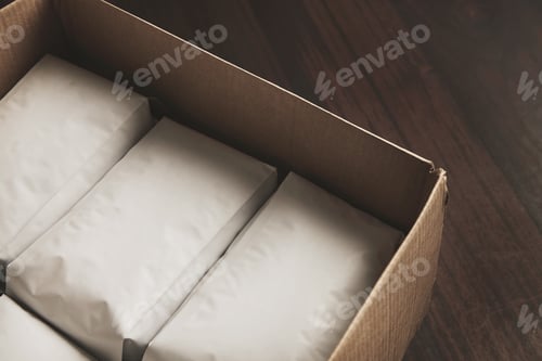 Preview: Closeup opened big carton box full of blank hermetic white packages