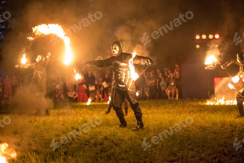 Preview: GRODNO, BELARUS - JULY 2019: Street performers hold a fire show with fireworks at night
