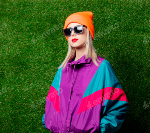 Preview: Woman in 80s sportsuit and glasses on green grass background