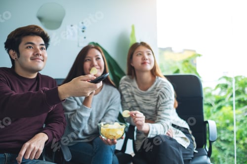 Preview: Friends eating potato chips while watching tv together
