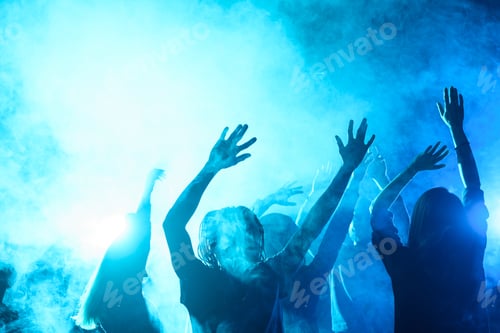 Preview: people dancing on party in nightclub with blue back light