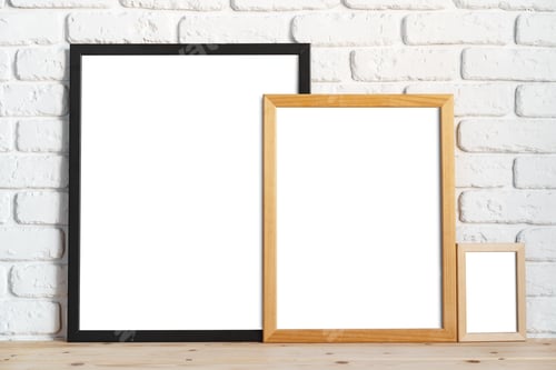 Preview: Photo frames on floor over white brick wall