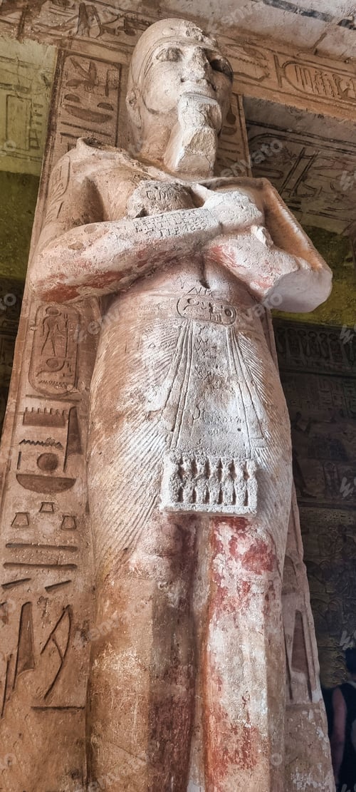 Preview: Egyptian statue holding a book in a majestic temple