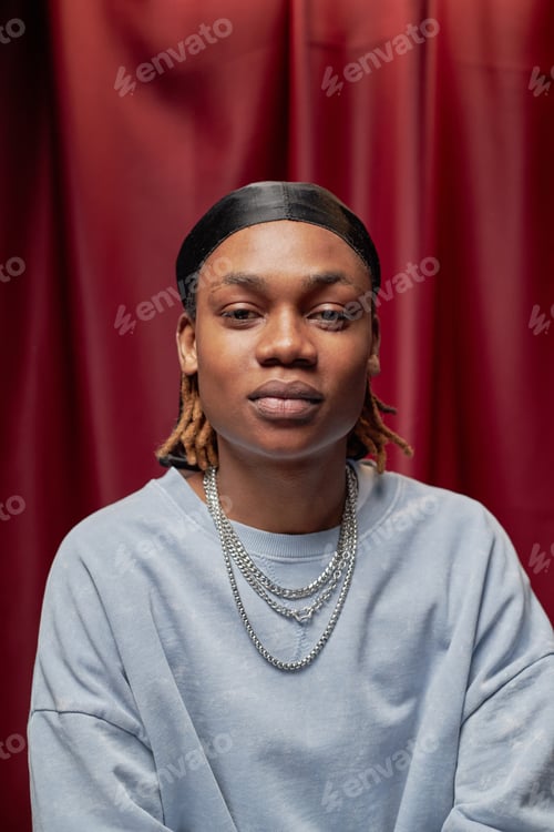Preview: Portrait of Young Adult Black Man Looking Confidently into Camera at Talent Competition