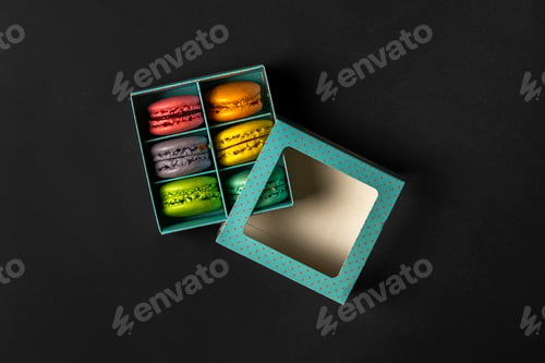 Preview: a top view of the french sweet desert - macaroons in the cardboard box