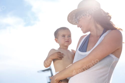 Preview: Mother carrying son in arms