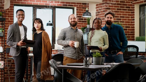 Preview: Portrait of multiethnic group doing teamwork on presentation