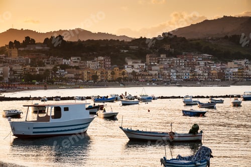 Preview: boats in marina of Giardini Naxos town on sunset